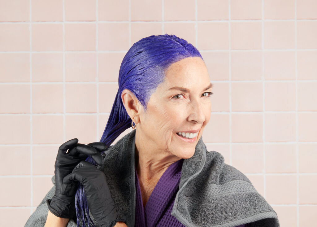 Woman with Gray hair using our purple-pigmented Neutralizer for Gray, Blonde, and Silver Hair