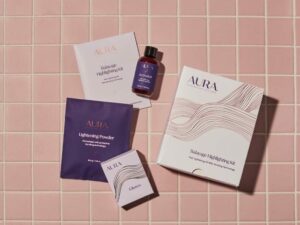 AURA Hair Care Balayage Highlighting Kit unboxed with contents that include Instructions, Lightening Powder, Activator, and Gloves.