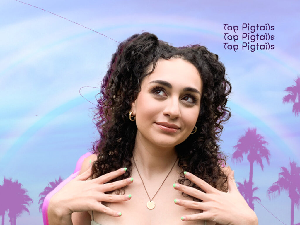 Look 1: Top Pigtails
AURA Hair Care model Giovanna wears Y2K-inspired Top Pigtails in her curly dark brunette hair. This festival style is great for all hair types as it beats the windy and dry desert weather. 