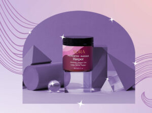 Photo of AURA's Pigmented Masque surrounded by gems and sparkles